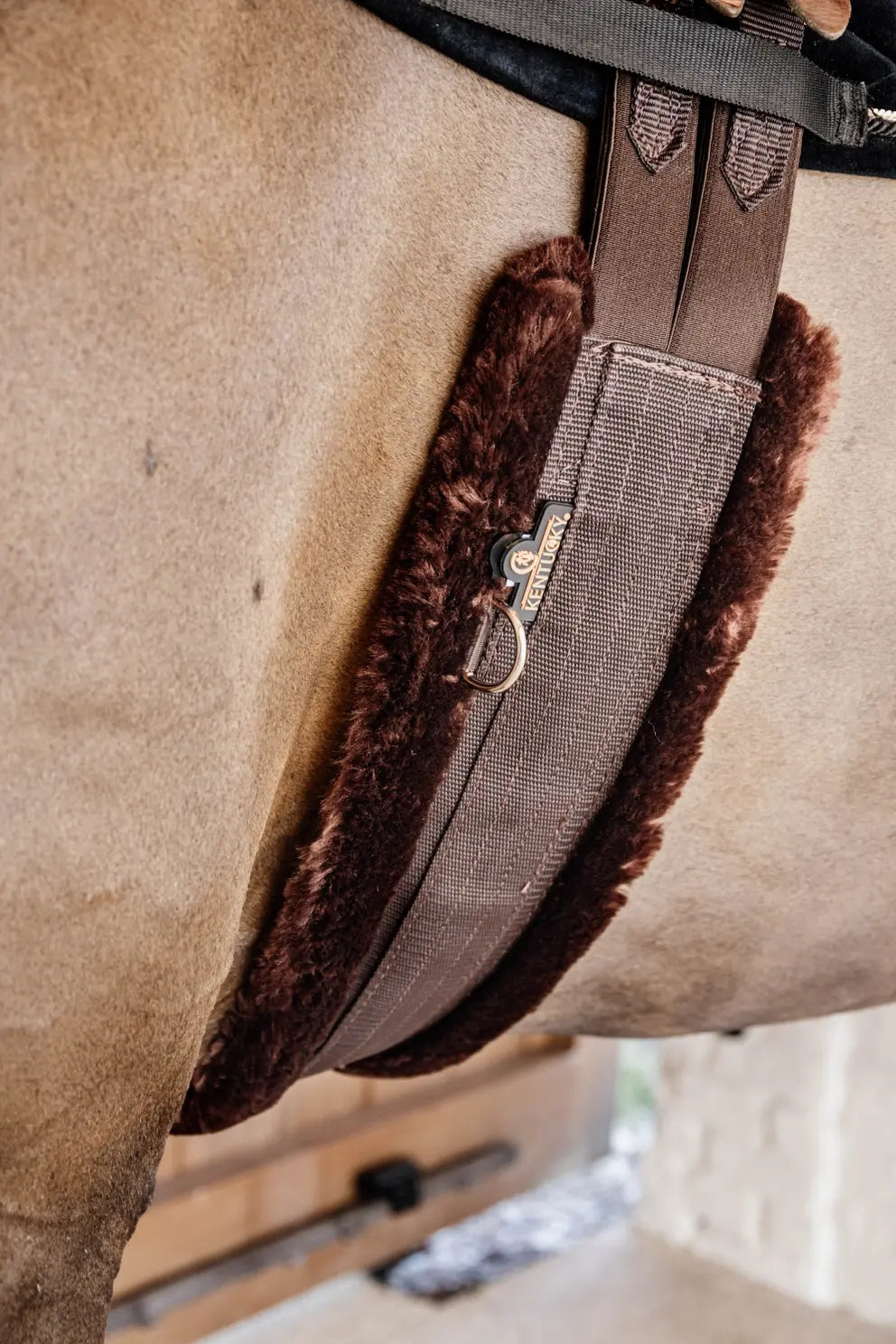 Kentucky Horsewear nylon girth with brown sheepskin brown